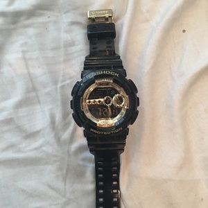 Black and gold G-Shock digital watch